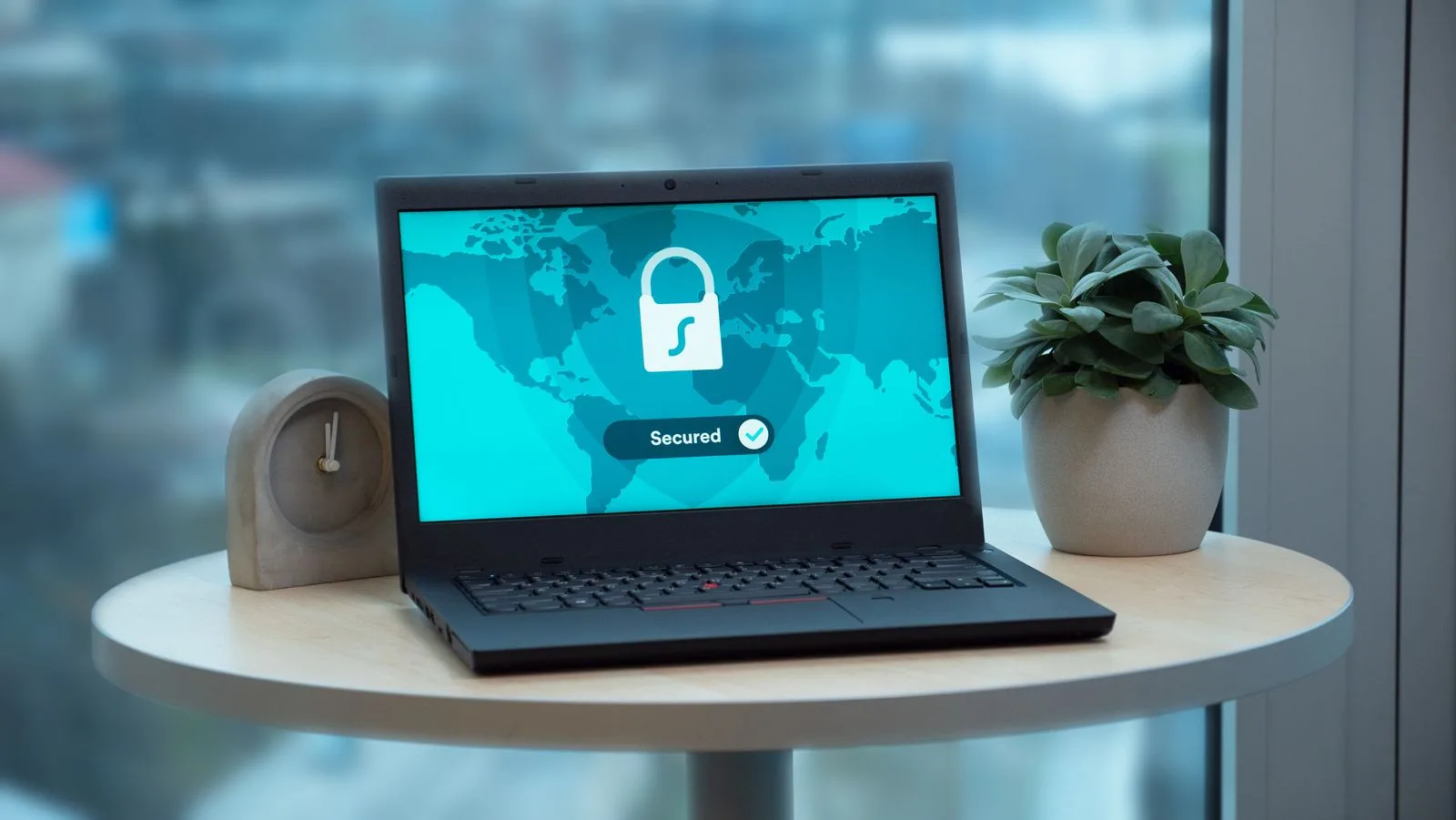 Laptop displaying a security lock icon on a desk, representing single sign-on authentication for a B2B platform