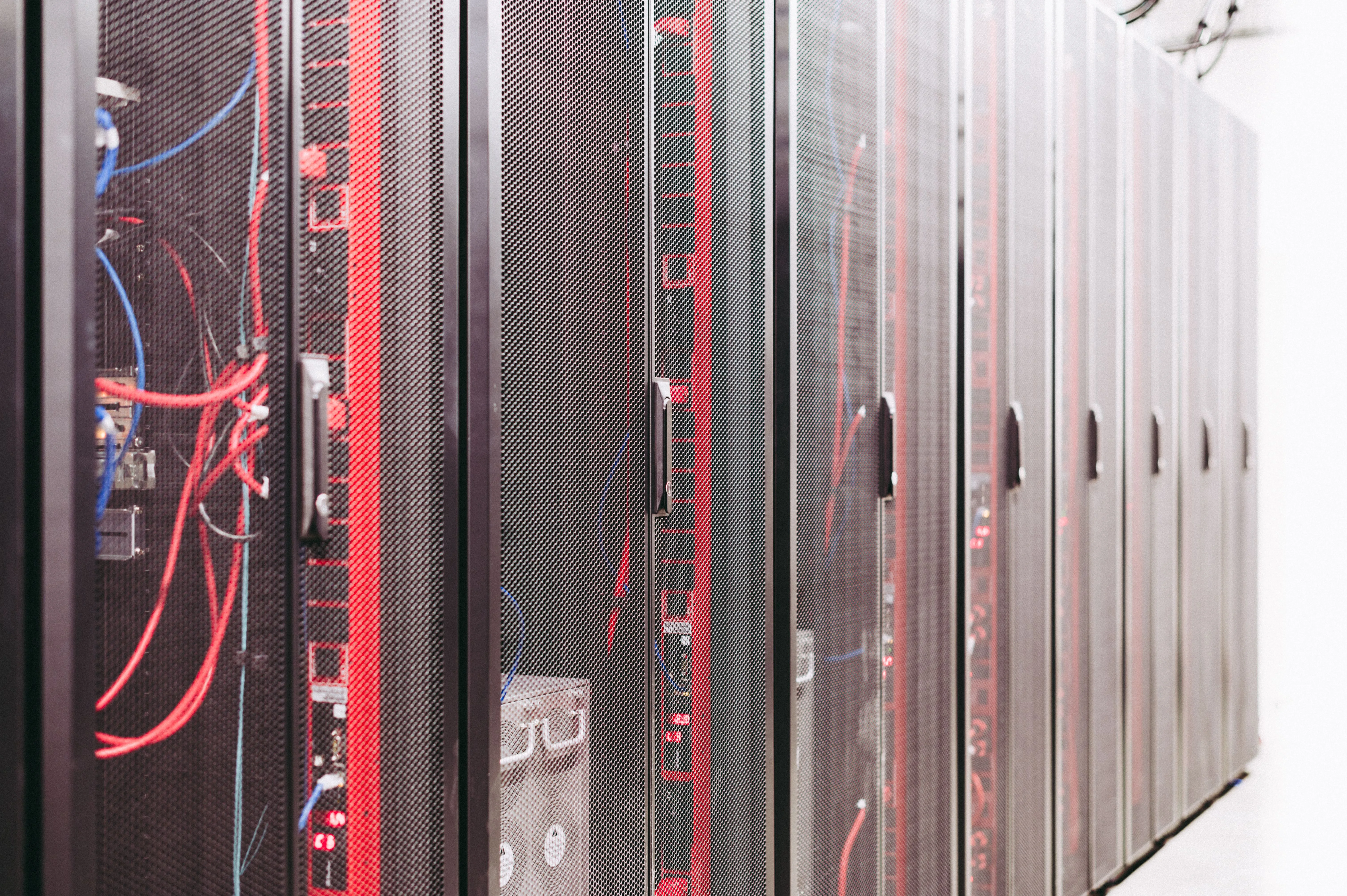 Server racks and network infrastructure representing scalable B2B web portal architecture