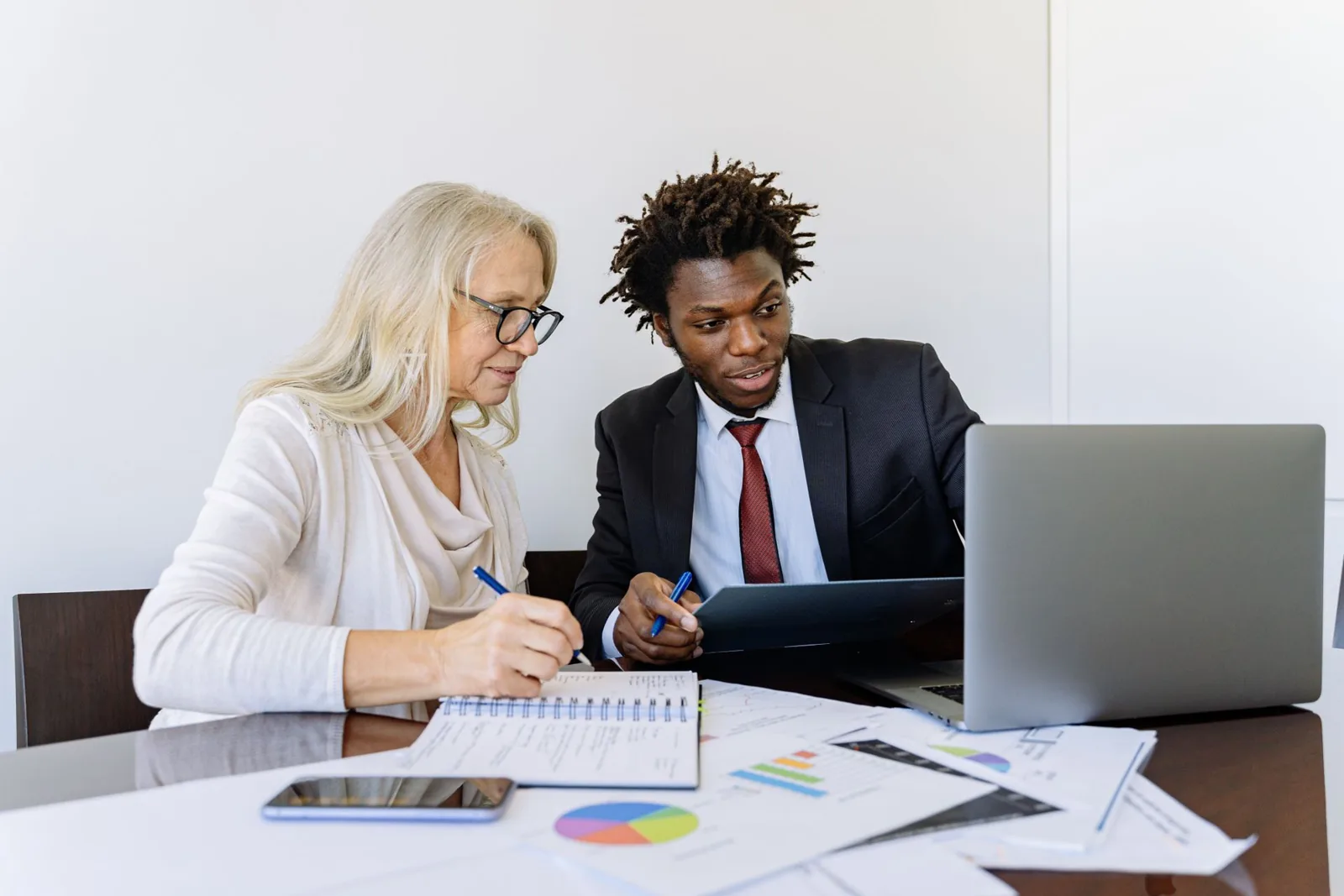Business owner reviewing software modules with a consultant