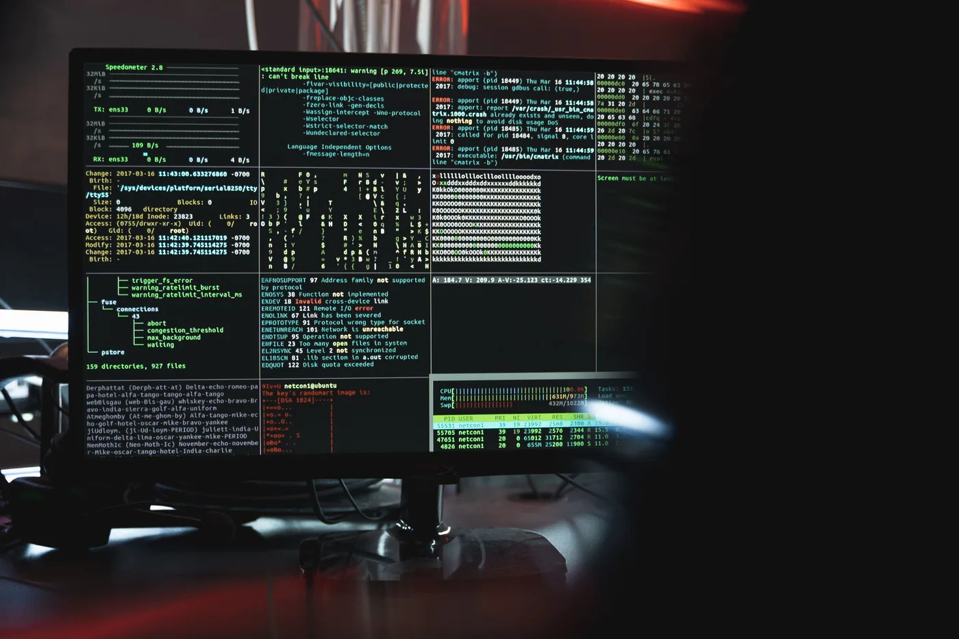 Two computer screens side by side showing code, representing a comparison between Node.js and .NET backend development