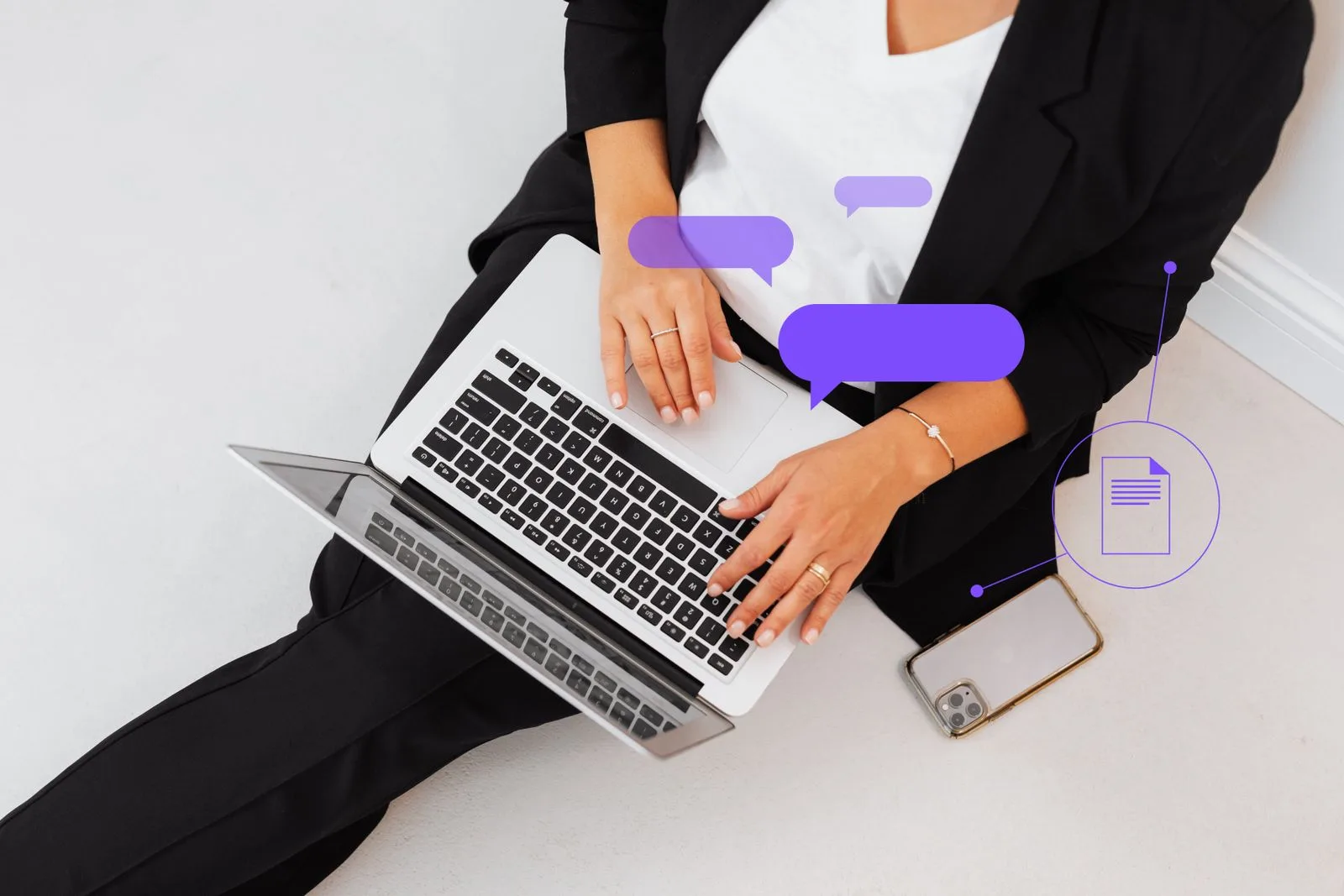 A high-angle shot of a woman typing on a laptop, symbolizing digital communication