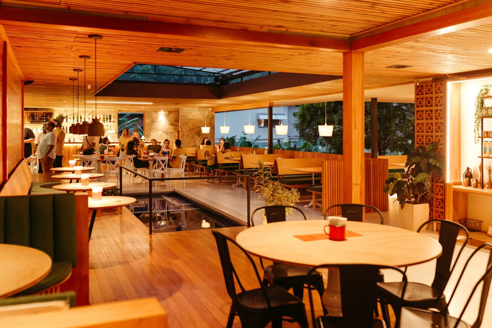 A warm, inviting restaurant interior with wooden decor and ambient lighting