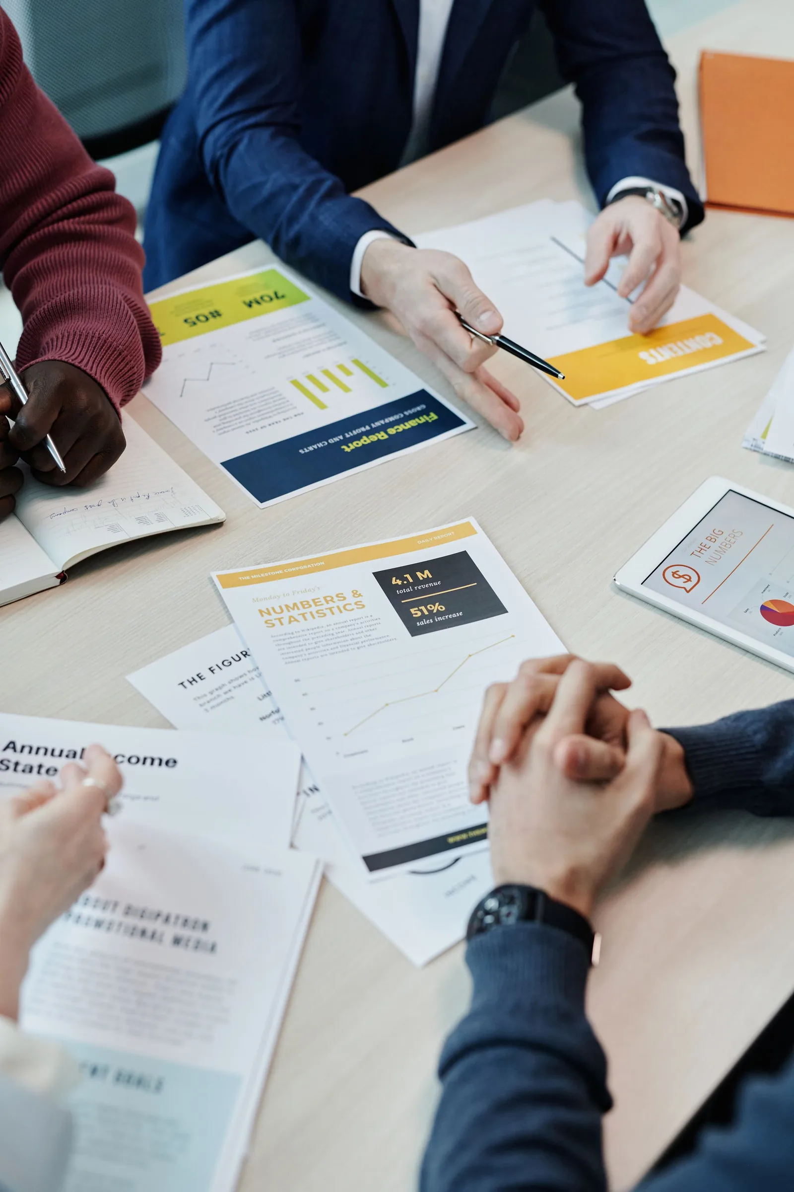 Two printed reports side by side showing mismatched sales totals for the same period