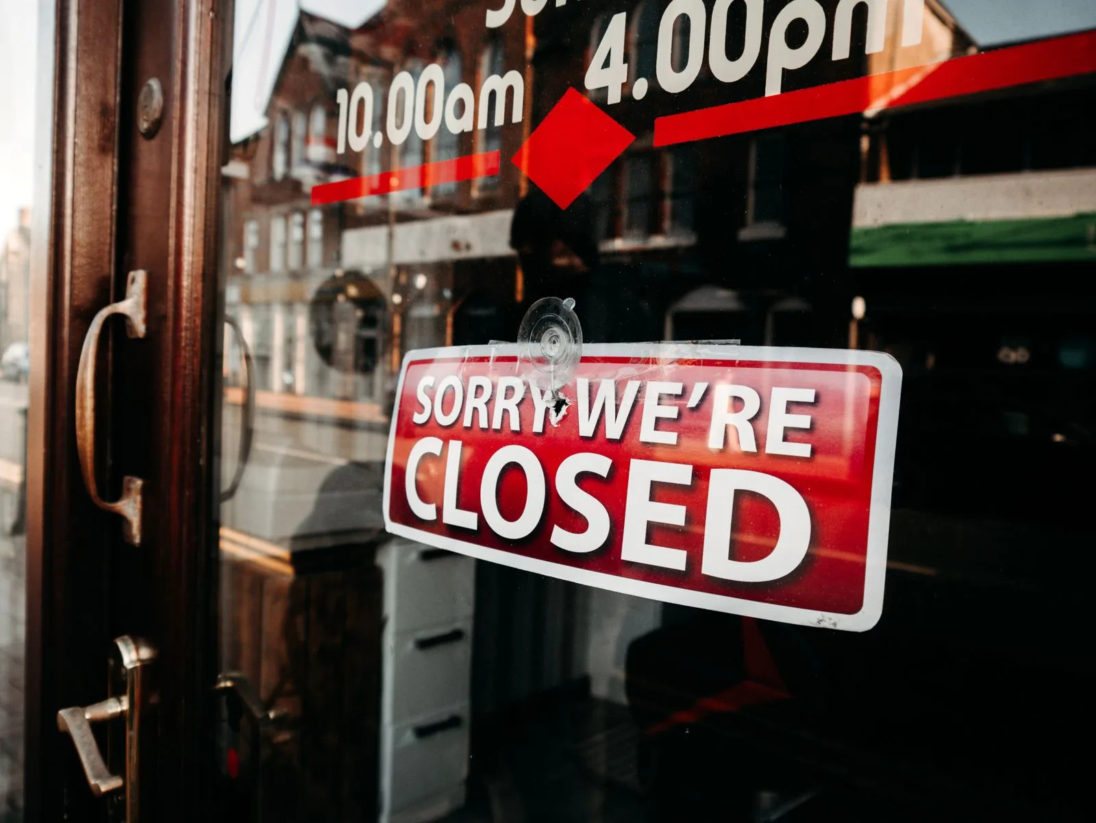 A closed sign hanging on a shop door, representing the risk of a software vendor shutting down